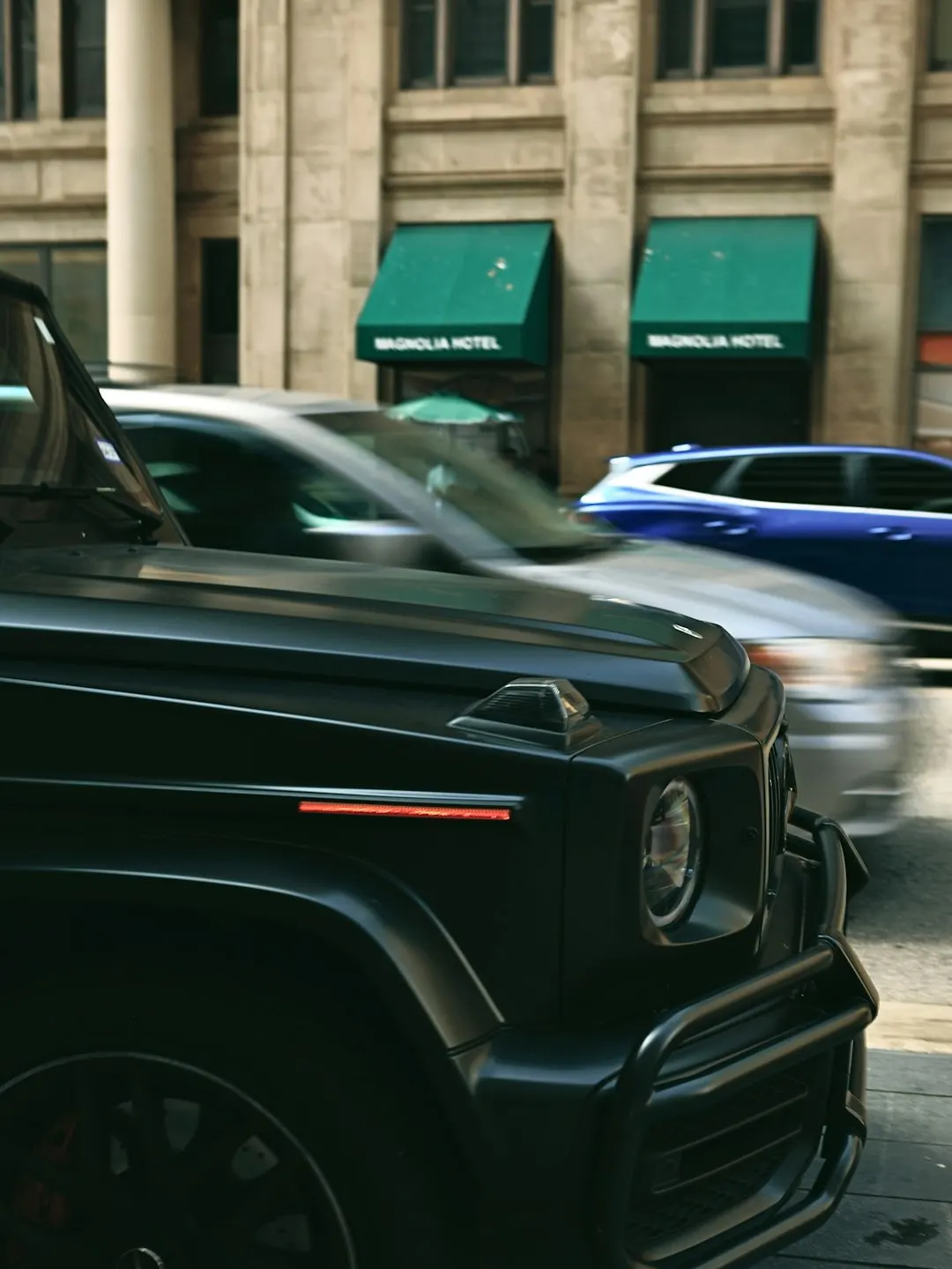 Black SUV waiting on a downtown street for an hourly night out